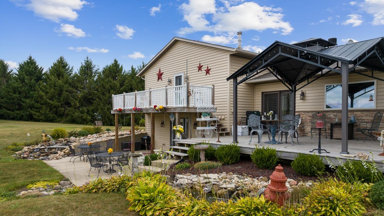 10388 Telegraph Road Winnebago, IL 61088 - Photo 36 of 48 a view of a dinning table and chairs in patio