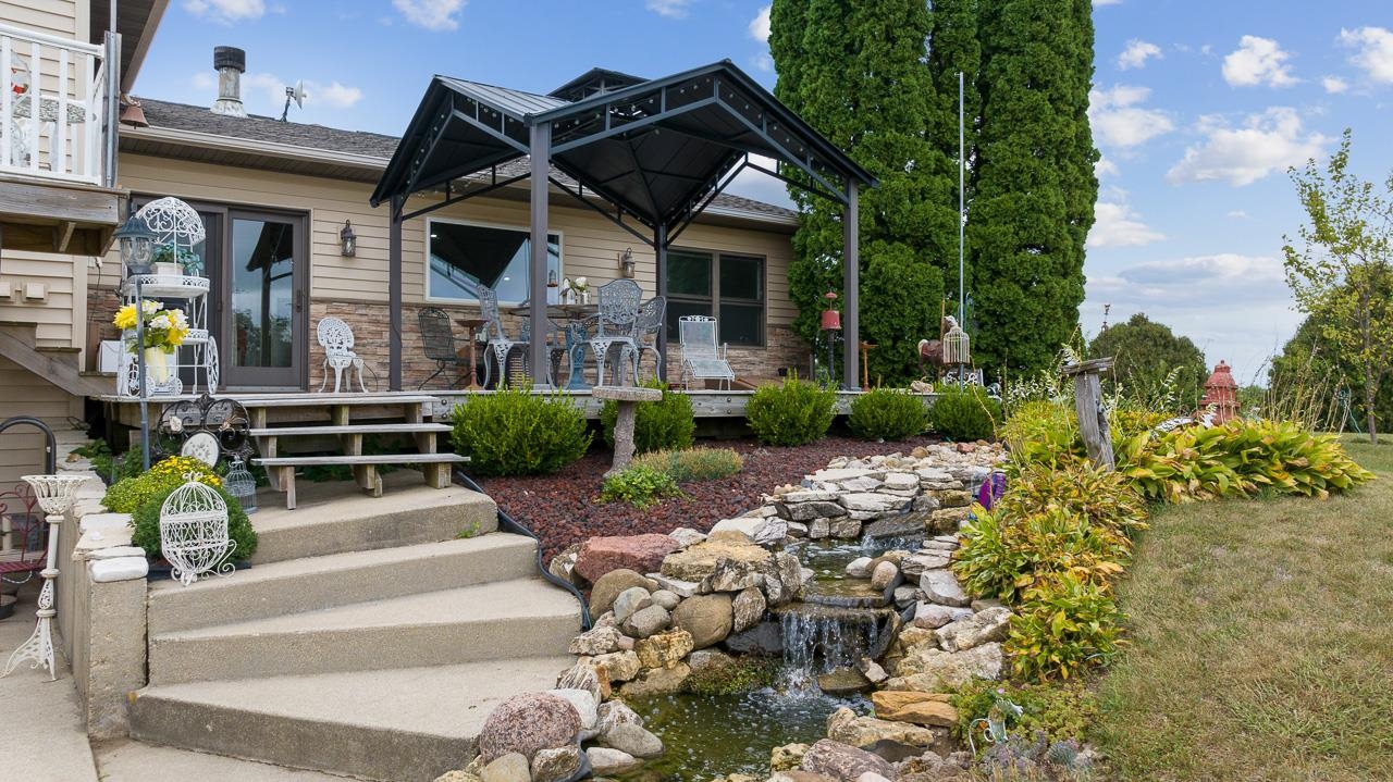 10388 Telegraph Road Winnebago, IL 61088 - Photo 38 of 48 a front view of a house with garden