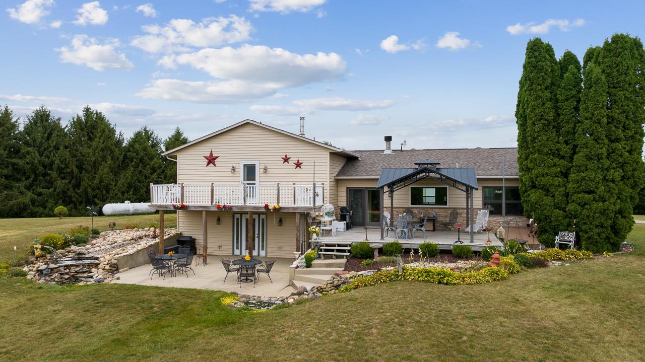10388 Telegraph Road Winnebago, IL 61088 - Photo 39 of 48 a view of a house with swimming pool and sitting area