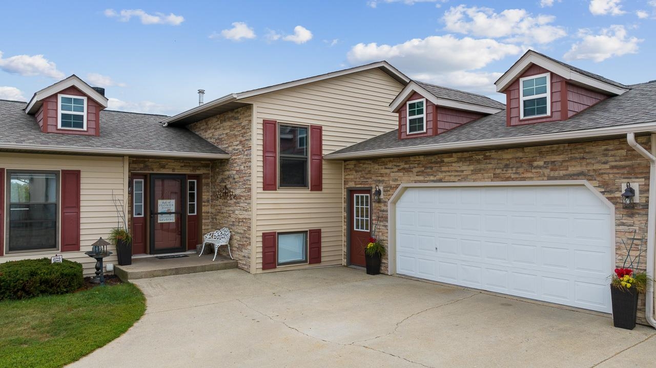 10388 Telegraph Road Winnebago, IL 61088 - Photo 4 of 48 front view of a house with a yard