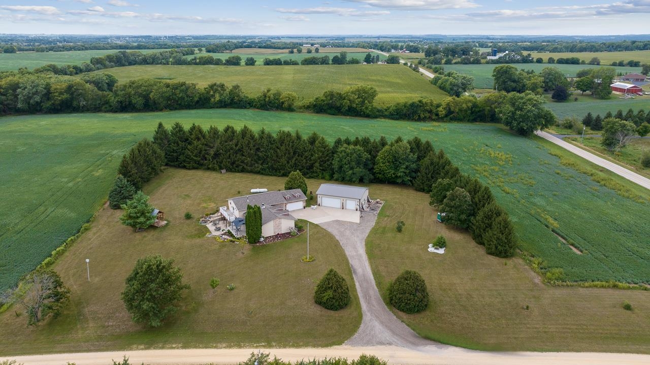 10388 Telegraph Road Winnebago, IL 61088 - Photo 48 of 48 an aerial view of a golf course with a swimming pool