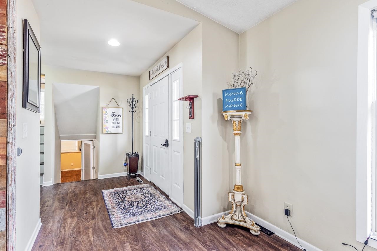 10388 Telegraph Road Winnebago, IL 61088 - Photo 5 of 48 a view of room with wooden floor and bathroom