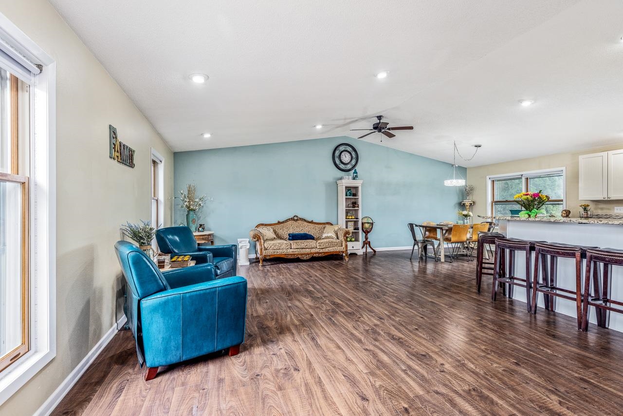 10388 Telegraph Road Winnebago, IL 61088 - Photo 6 of 48 a living room with furniture and wooden floor