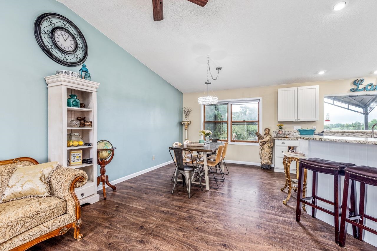 10388 Telegraph Road Winnebago, IL 61088 - Photo 9 of 48 a view of a dining room with furniture and a window
