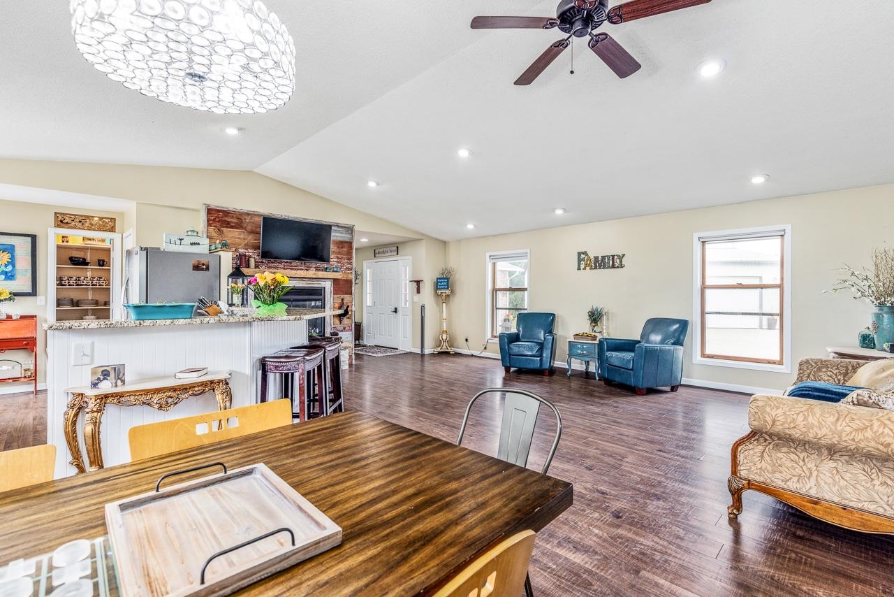 10388 Telegraph Road Winnebago, IL 61088 - Photo 10 of 48 a living room with furniture and a wooden floor