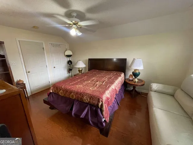 a bed room with a bed and a chandelier