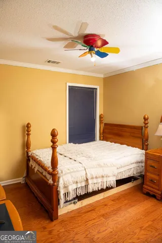 a bedroom with bed and window