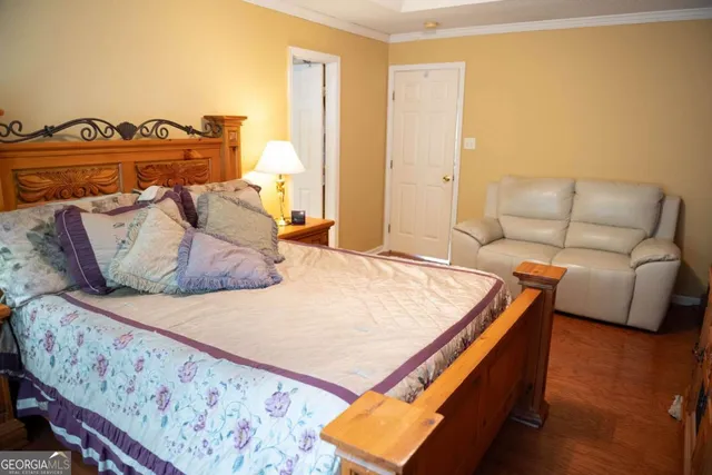 a bedroom with a bed and a couch