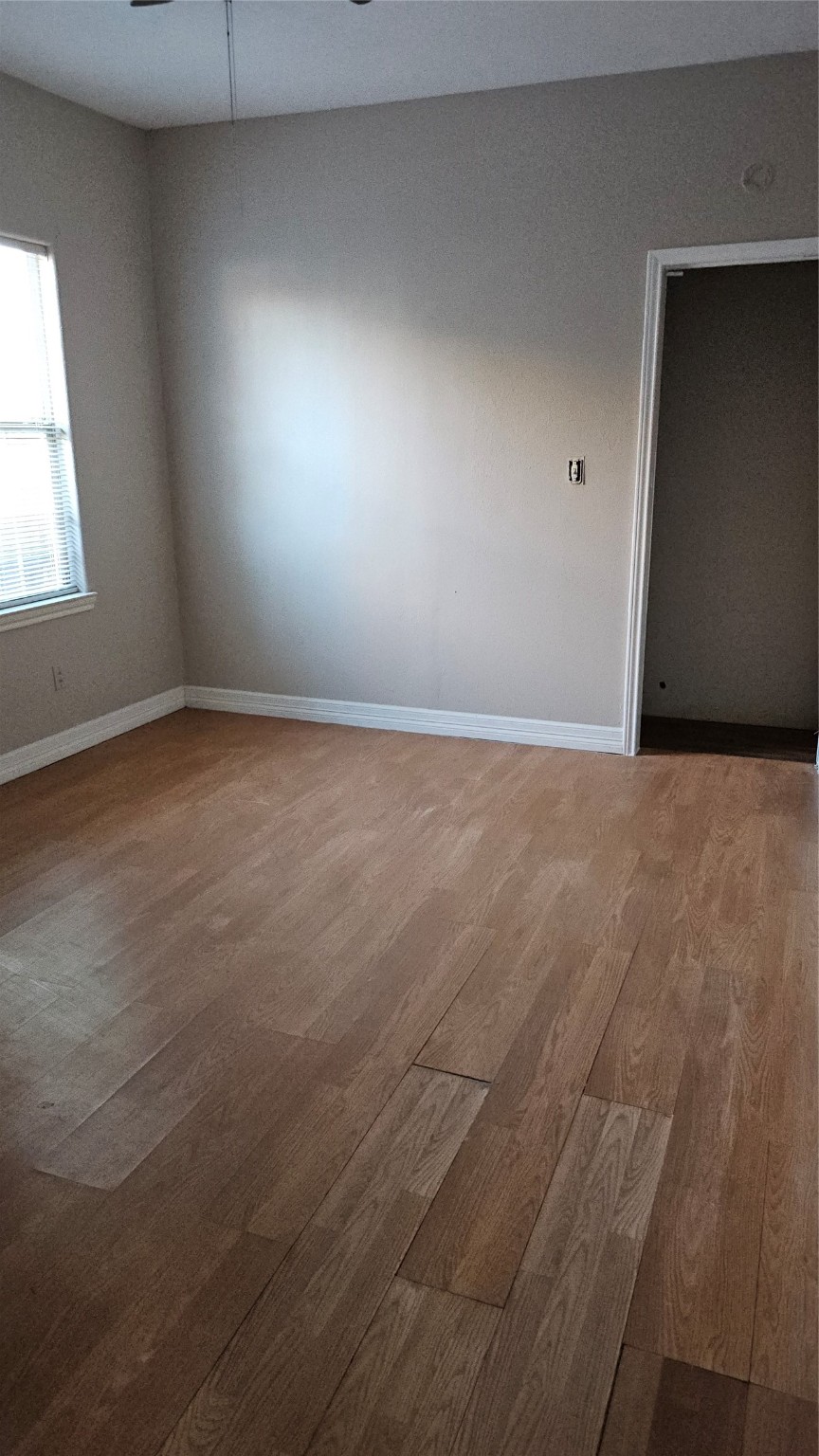4714 Sharon Street Houston, TX 77020 - Photo 11 of 14 an empty room with a window
