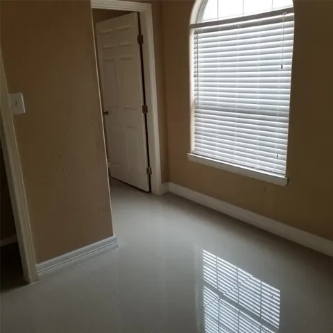 a view of a room that has a window in it