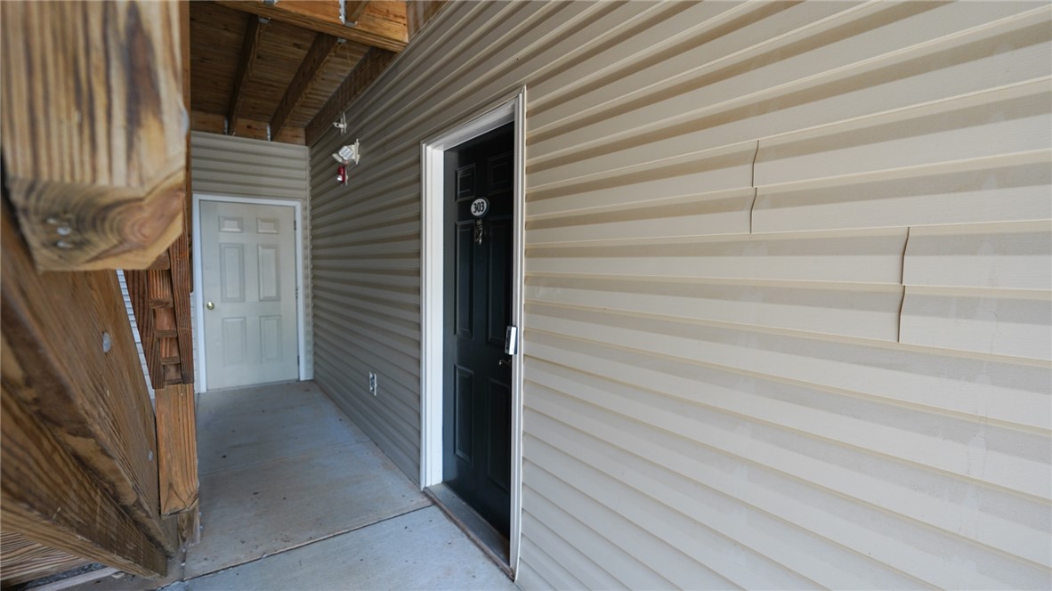 303 Lookover Drive Anderson, SC 29621 - Photo 5 of 46 This outdoor entrance features a practical design with durable siding and a wooden staircase.