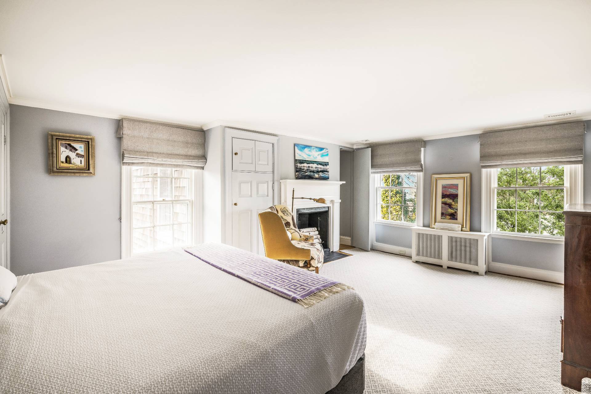 330 Main Street Sag Harbor, NY 11963 - Photo 21 of 32 a bedroom with a large bed and a flat tv screen