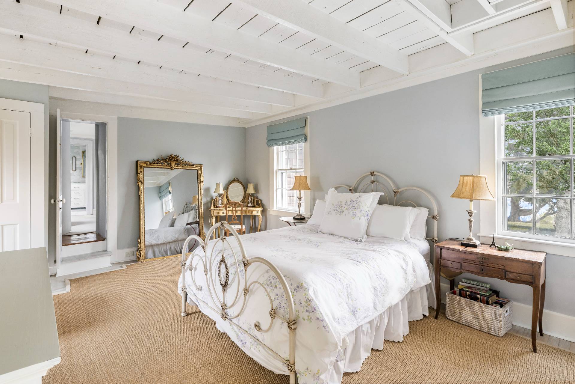 330 Main Street Sag Harbor, NY 11963 - Photo 24 of 32 a bed room with a bed and a chair