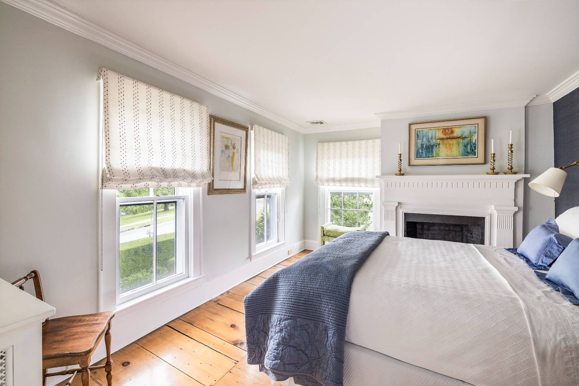 330 Main Street Sag Harbor, NY 11963 - Photo 26 of 32 a spacious bedroom with a bed and a chair with the outer view