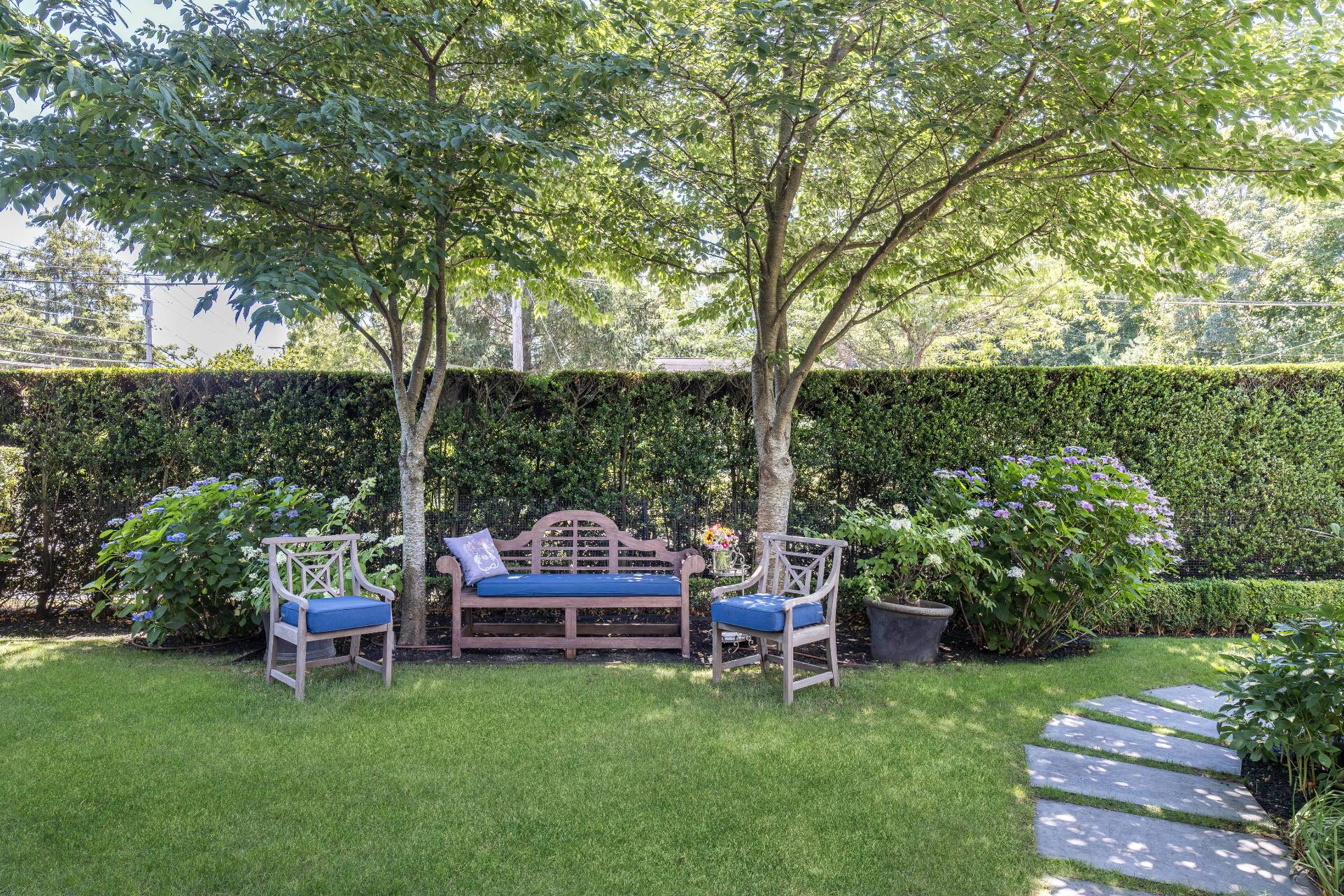 330 Main Street Sag Harbor, NY 11963 - Photo 32 of 32 a view of a chair and table in backyard of the house