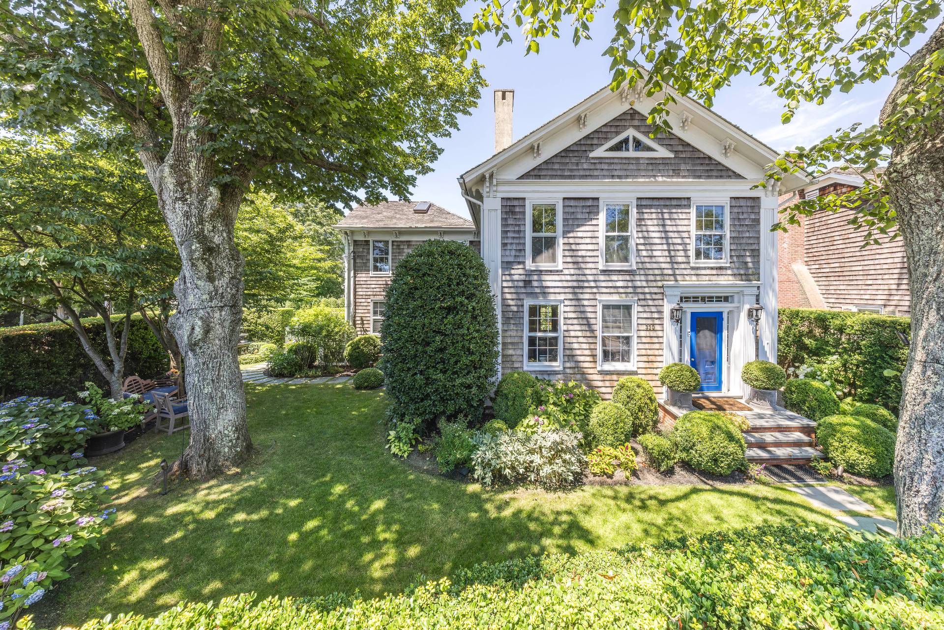 330 Main Street Sag Harbor, NY 11963 - Photo 6 of 32 a front view of a house with a yard