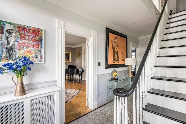 a view of a hallway with seating area