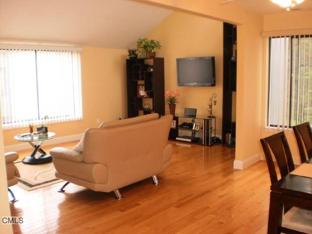 4 Blueberry Lane Ridgefield, CT 06877 - Photo 1 of 1 a living room with furniture and a flat screen tv