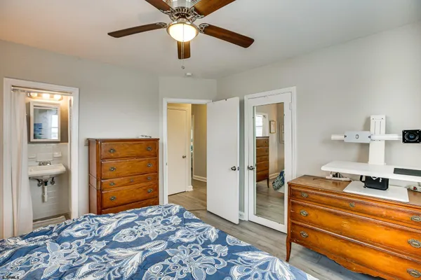 a bedroom with a bed and a dresser