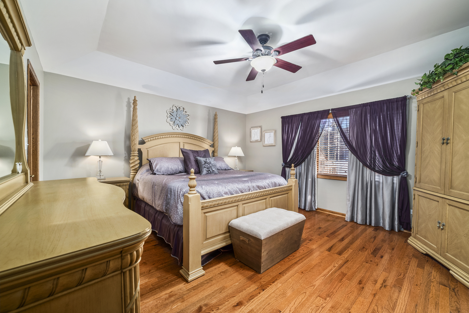 21181 Deerpath Road Frankfort, IL 60423 - Photo 16 of 25 a bedroom with a bed and a chandelier