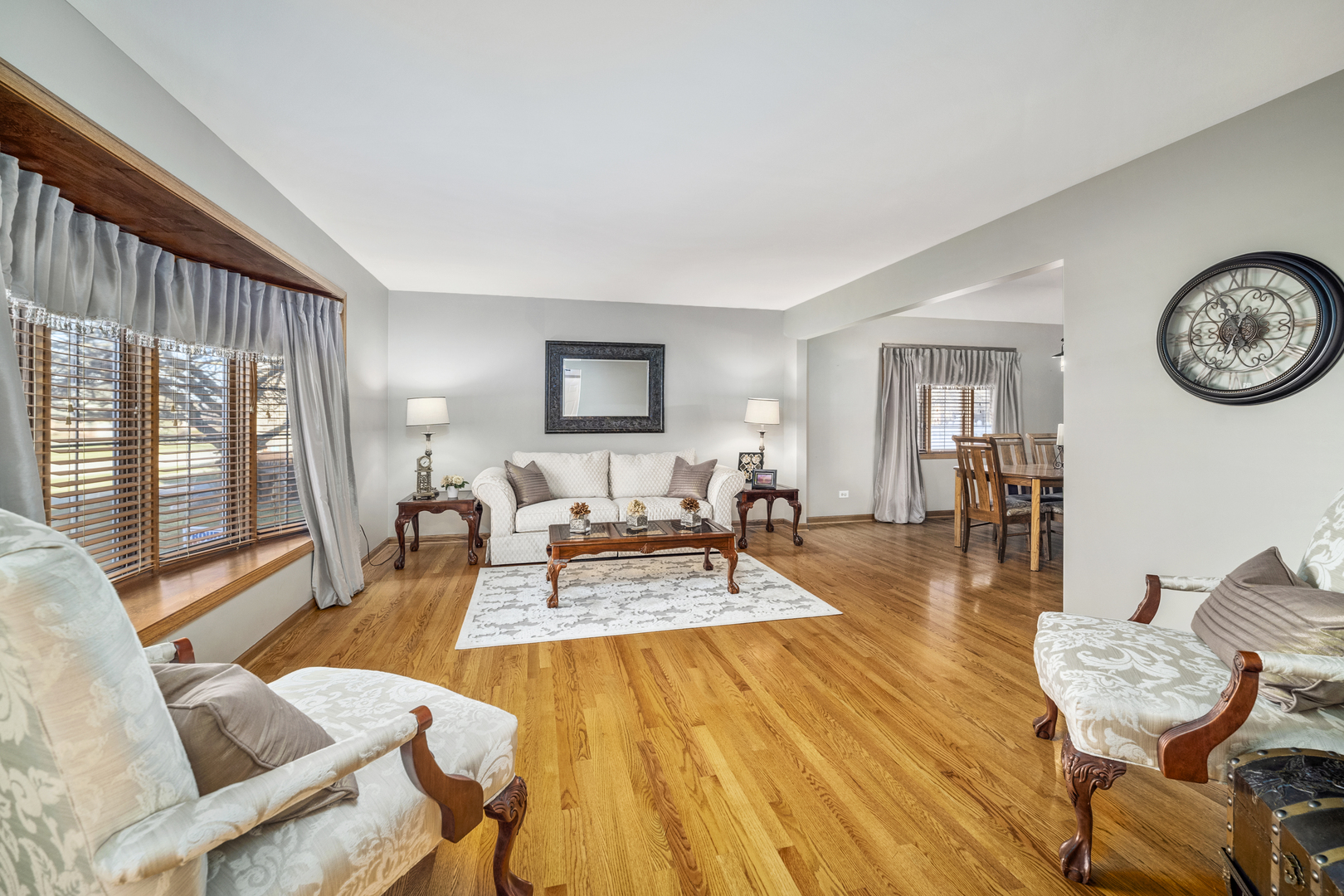 21181 Deerpath Road Frankfort, IL 60423 - Photo 4 of 25 a living room with furniture a wooden floor and a large window