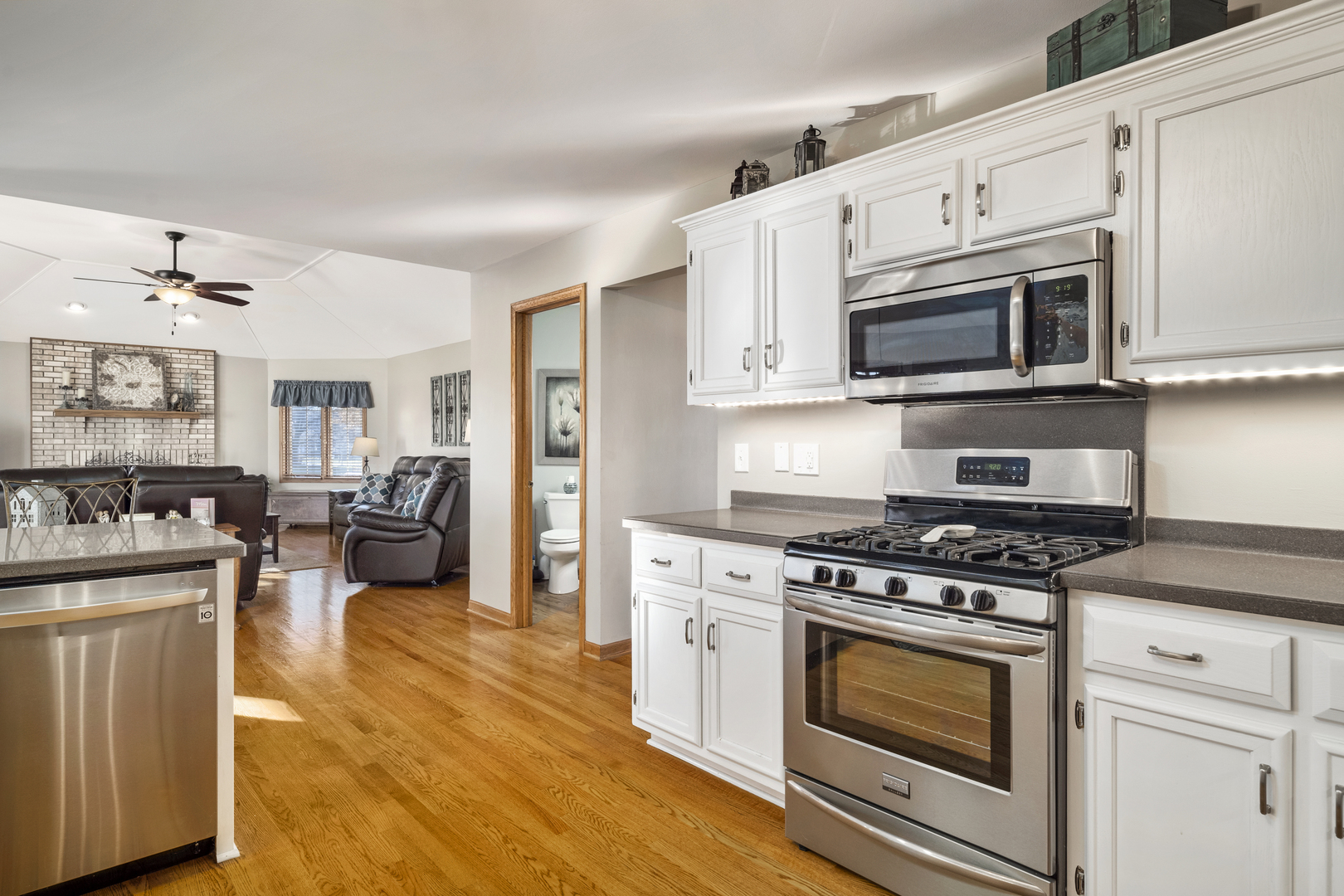 21181 Deerpath Road Frankfort, IL 60423 - Photo 10 of 25 a kitchen with stainless steel appliances white cabinets and a stove top oven
