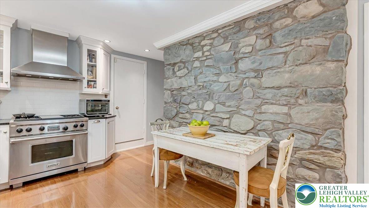 119 Falls Drive Cresco, PA 18326 - Photo 13 of 56 a view of a kitchen with a stove and wooden floor