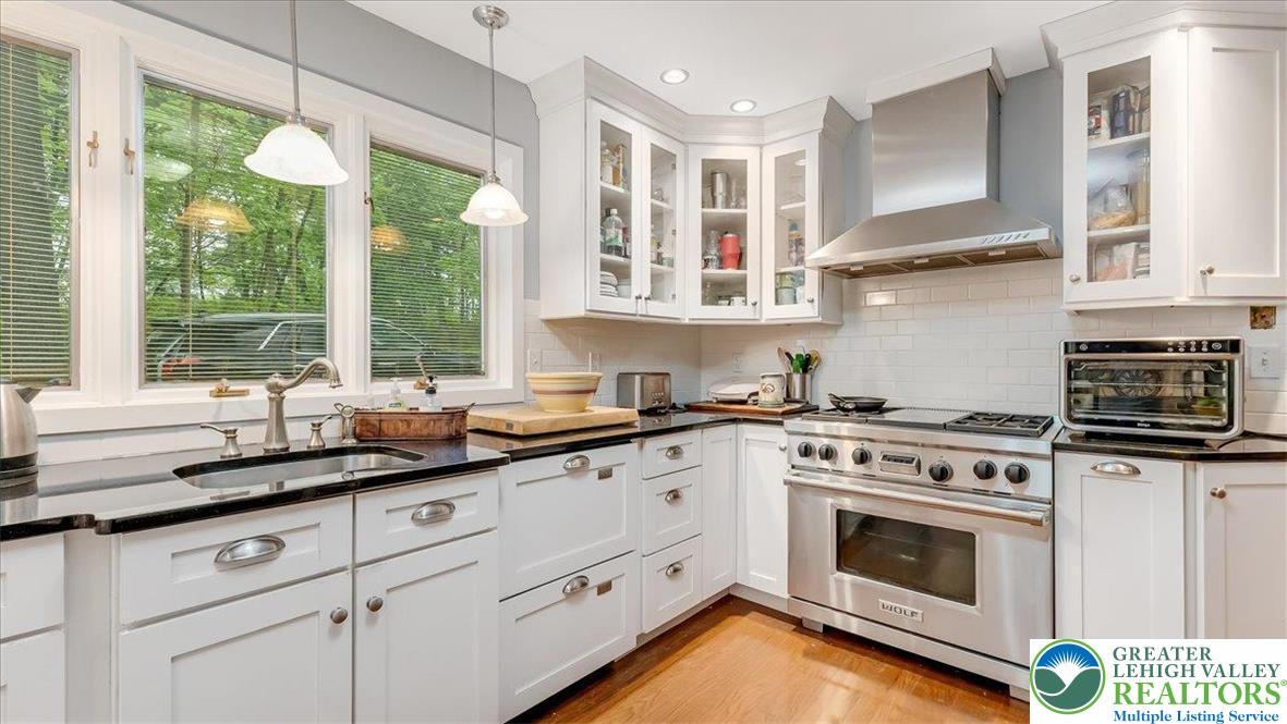 119 Falls Drive Cresco, PA 18326 - Photo 15 of 56 a kitchen with stainless steel appliances granite countertop white cabinets and a window