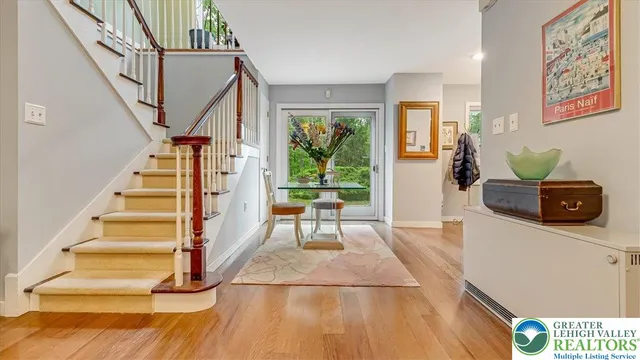 a bedroom with a large bed and ceiling fan