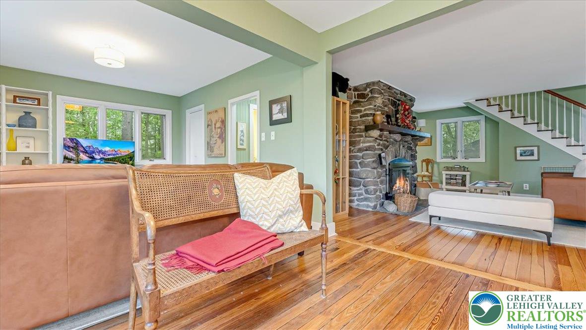 119 Falls Drive Cresco, PA 18326 - Photo 21 of 56 a living room with furniture and a floor to ceiling window