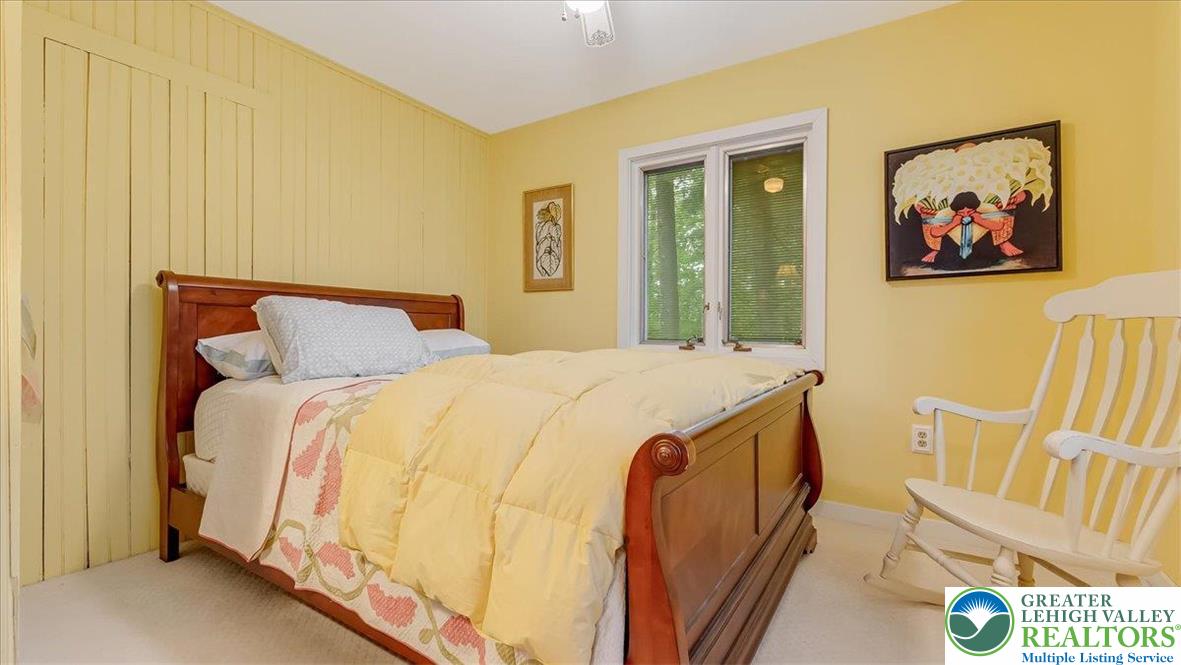 119 Falls Drive Cresco, PA 18326 - Photo 31 of 56 a bed sitting in a bedroom next to a window