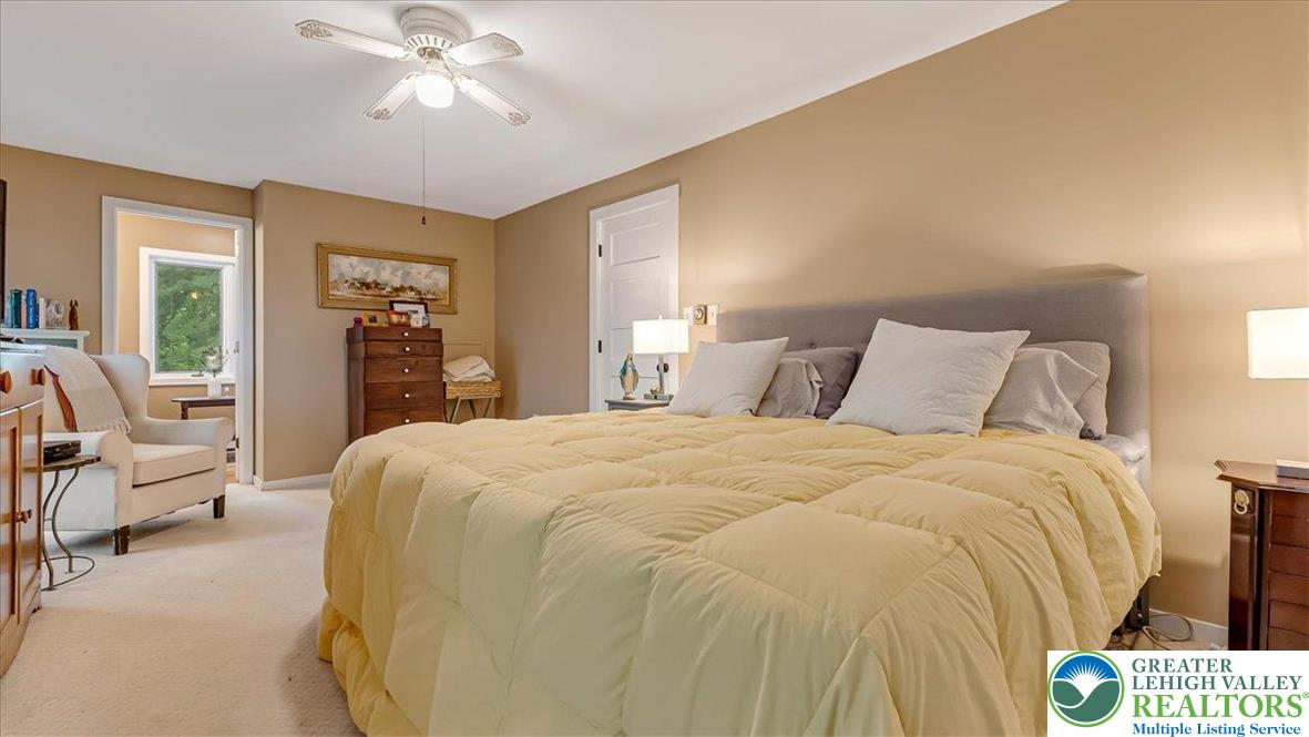 119 Falls Drive Cresco, PA 18326 - Photo 36 of 56 a bedroom with a large bed and ceiling fan