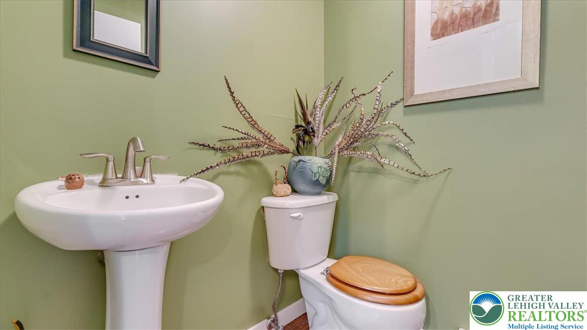 119 Falls Drive Cresco, PA 18326 - Photo 10 of 56 a bathroom with a toilet sink and mirror