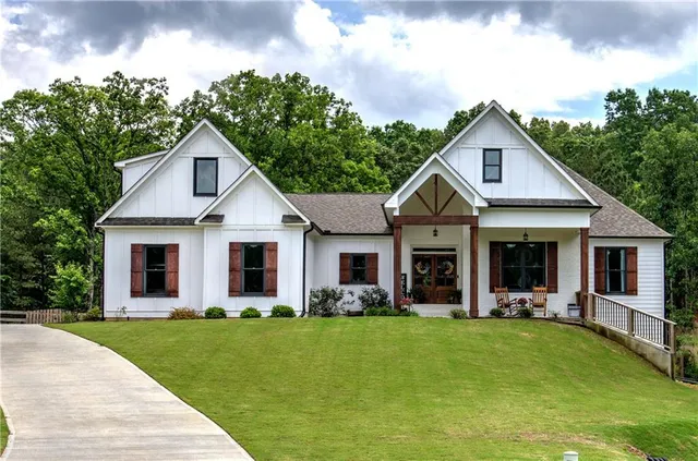 a front view of house with yard and green space