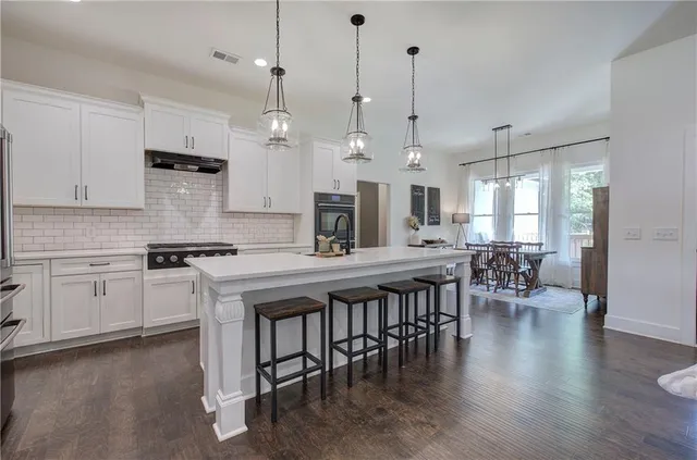 a living room with furniture rug and window