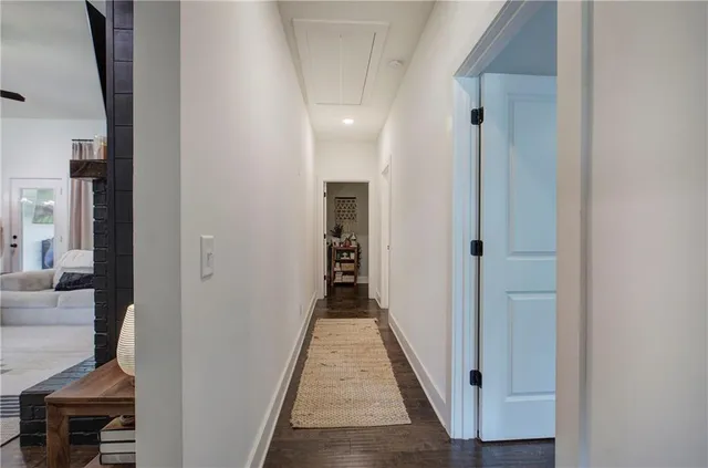 a bathroom with a granite countertop sink a toilet and a mirror