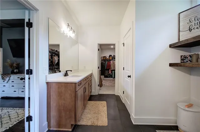 a living room with furniture rug and wooden floor
