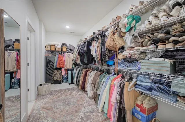 a view of a house with garden and a tree