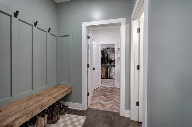 a aerial view of a house with a yard and lake view