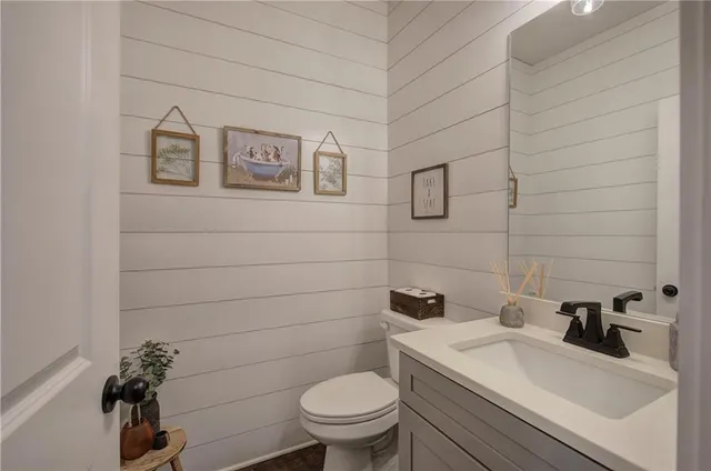 an aerial view of residential houses with outdoor space and street view