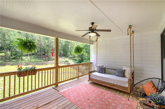 an aerial view of residential house with outdoor space and trees