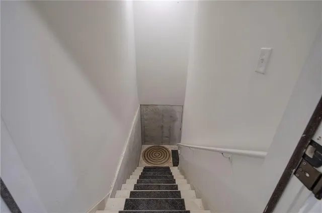 a backyard of a house with a yard and outdoor seating