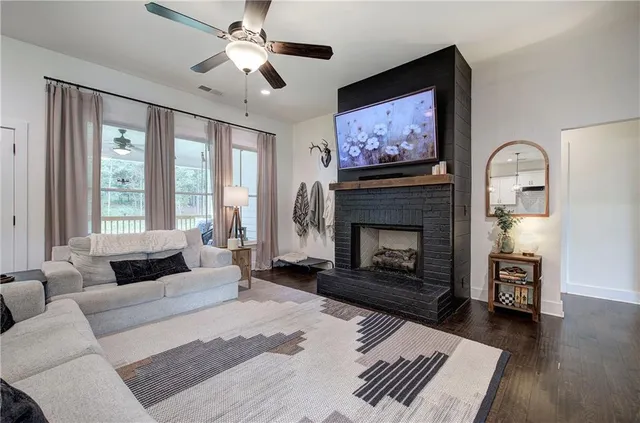 a kitchen with kitchen island granite countertop a sink a counter top space stainless steel appliances and cabinets