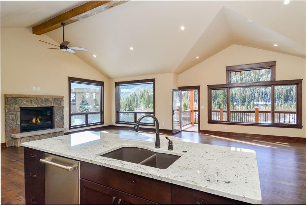 64 Erickson Loop, Unit 12B Keystone, CO 80435 - Photo 2 of 15 a kitchen with granite countertop a sink and a large window