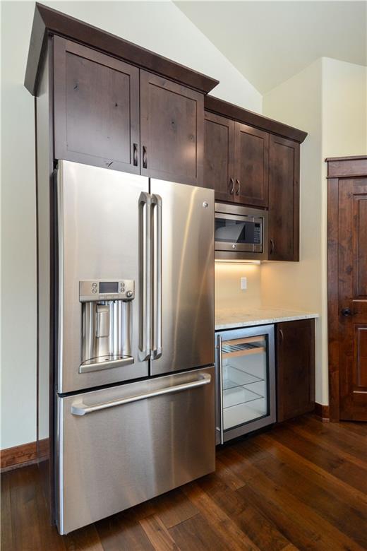 64 Erickson Loop, Unit 12B Keystone, CO 80435 - Photo 4 of 15 a metallic refrigerator freezer sitting in a kitchen