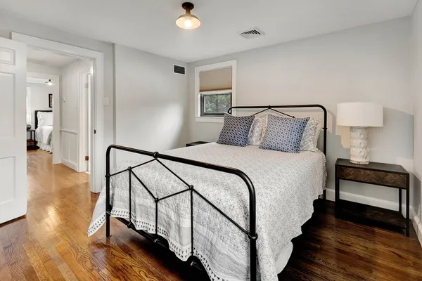 a bed room with a bed and a window