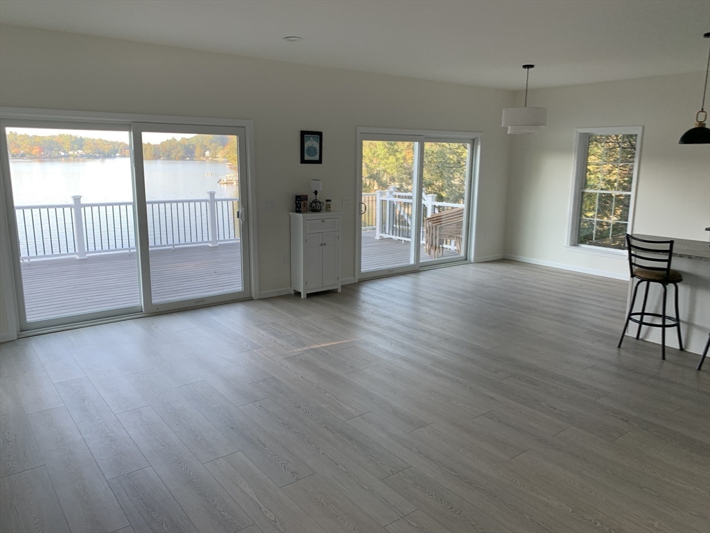 38 Stevens Park Road Charlton, MA 01507 - Photo 13 of 40 an empty room with wooden floor and windows