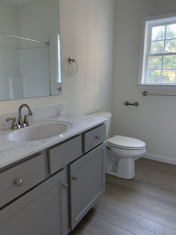 38 Stevens Park Road Charlton, MA 01507 - Photo 16 of 40 a bathroom with a toilet a sink and mirror