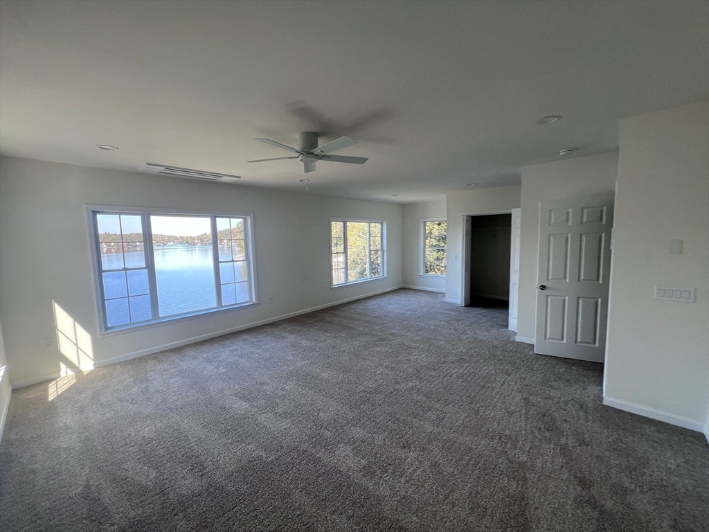 38 Stevens Park Road Charlton, MA 01507 - Photo 25 of 40 a view of an empty room with window and chandelier fan