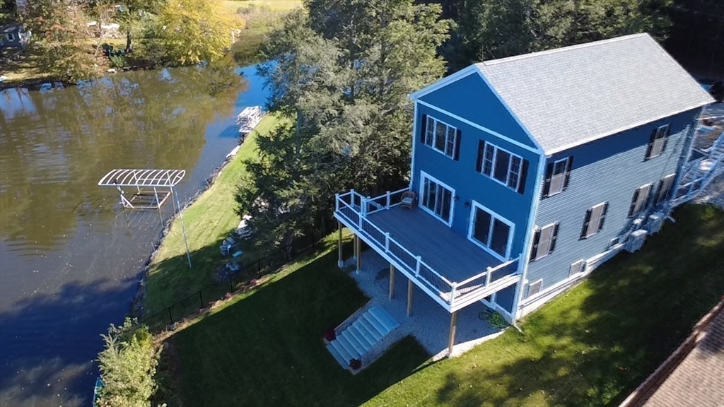 38 Stevens Park Road Charlton, MA 01507 - Photo 39 of 40 a view of a house with a yard deck and a patio